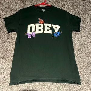 Green OBEY shirt with multi color butterflies. (small)